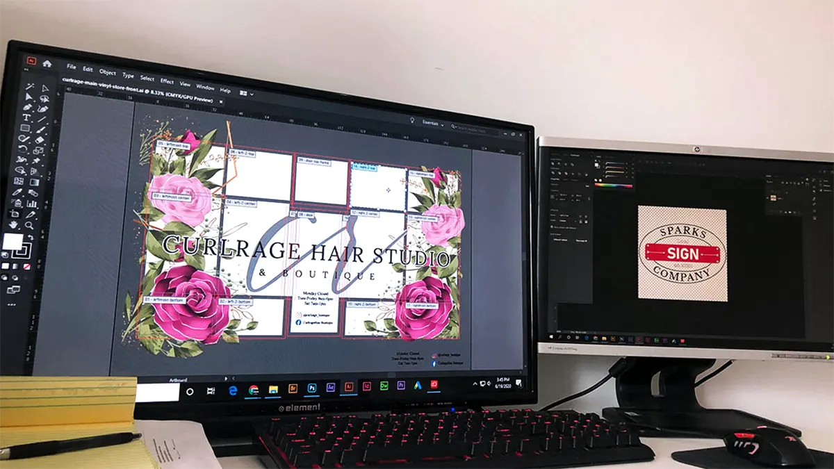 Curlrage Hair Salon floral window artwork laid out pane by pane in Adobe Illustrator, with the Sparks Sign Company logo open on a second monitor