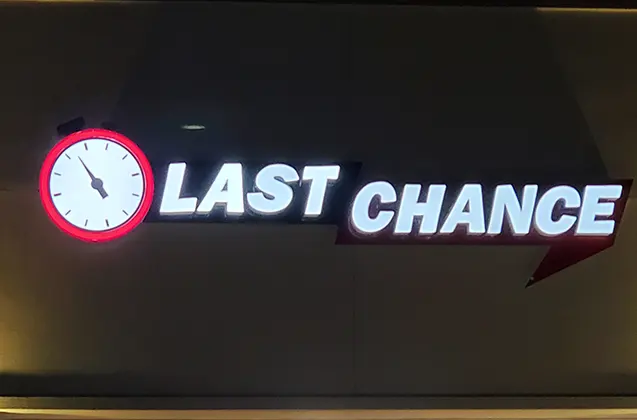 Last Chance channel letter sign installed and lighted at night | Graphic Design | Sparks Sign Company