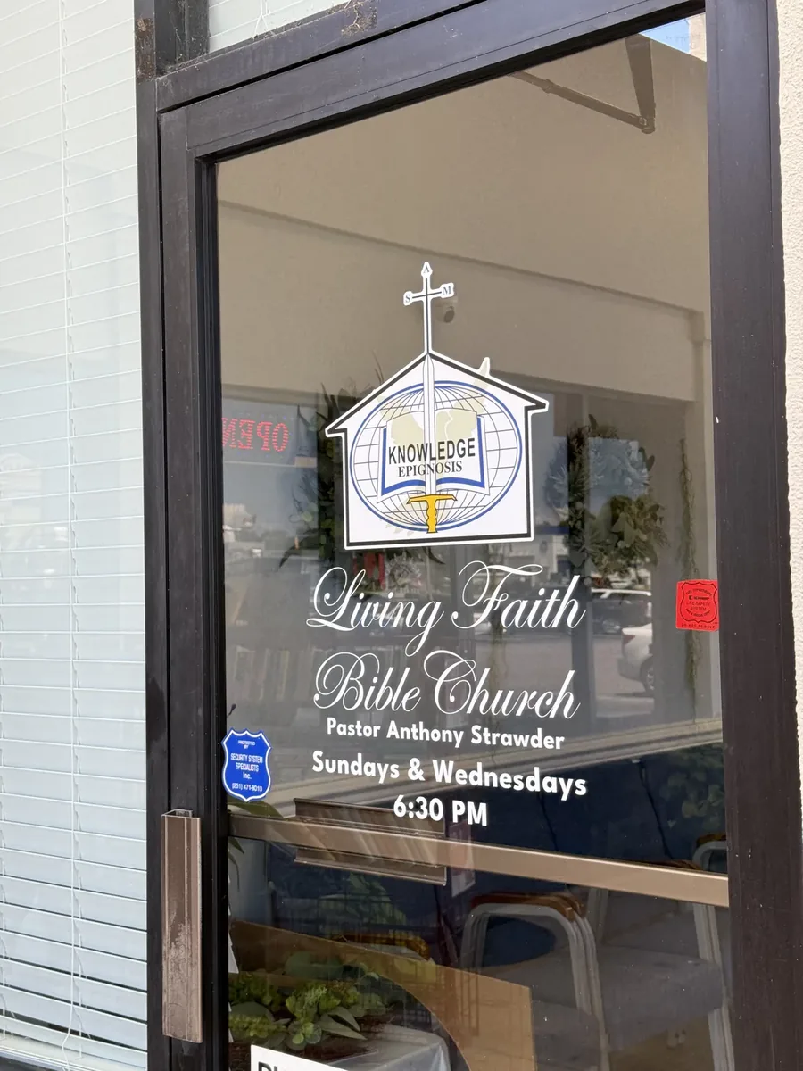 Living Faith Bible Church glass door vinyl with the church logo, name and service times