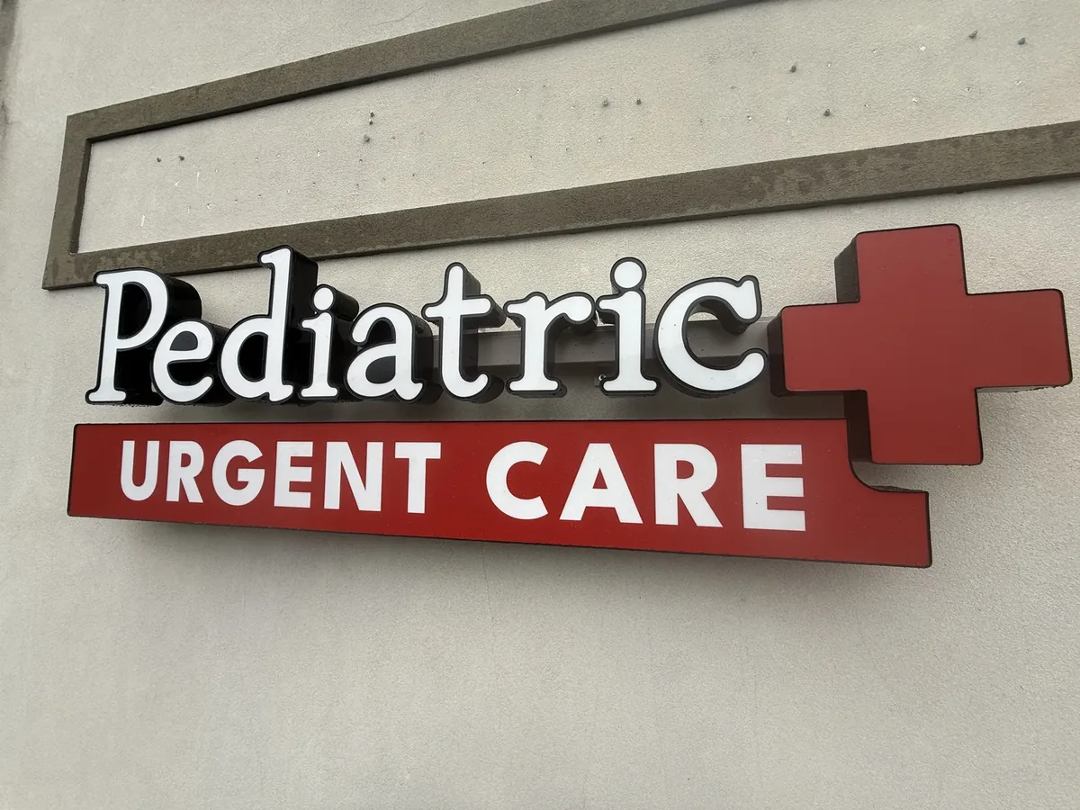 Pediatric Urgent Care channel letters with a raised red cross on the building